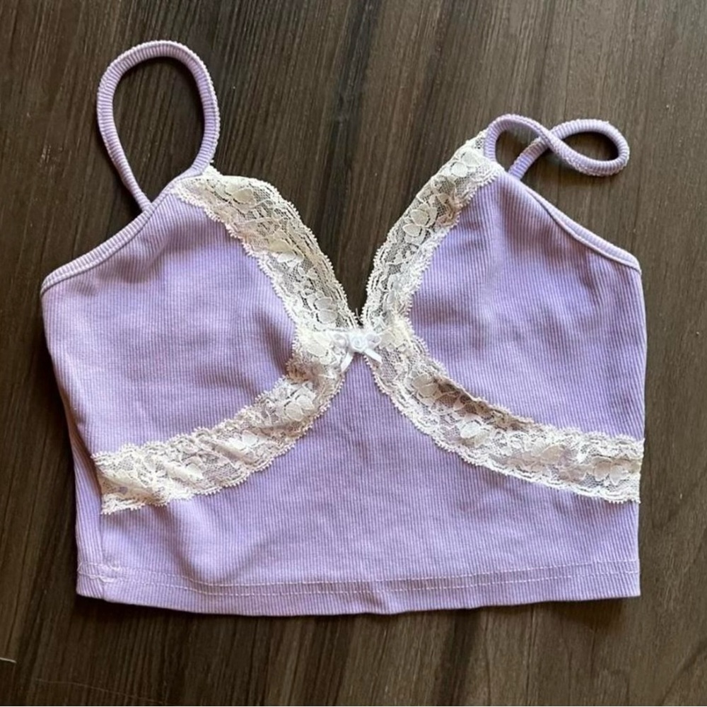 lavender cami shirt with white lace detail.